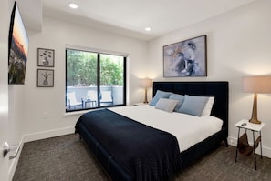 Bedroom 2 has a private Patio view. Enjoy the luxe and comfortable King Bed