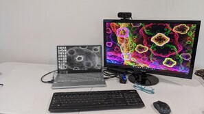 Workstation for a laptop, Monitor, Keyboard, Mouse, and Webcam available for use