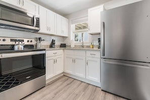 Fully equipped kitchen including a drip coffee pot for your morning coffee