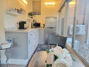 The kitchenette comes equipped with microwave, toaster, electric kettle, double burners, pans and equipment to make great things like scrambled eggs or Mac n cheese. To grill a steak, use the gas grill out near the patio.