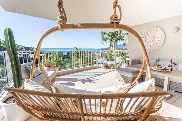 Hanging basket chair with incredible ocean views