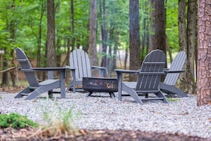 Fire pit with comfortable Adirondack chairs
