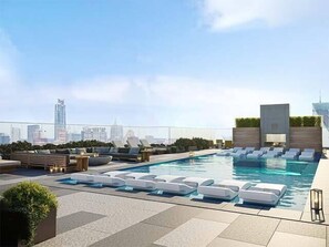 Seasonally heated Rooftop pool with free cabanas & sun loungers