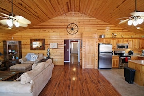 Upon entering the front door you are greeted with a vaulted ceiling & warm wood