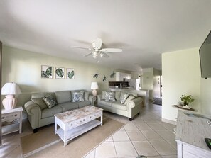 Living room with open floor plan into the kitchen