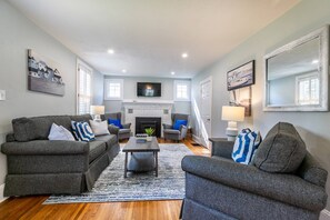 Gather around the beautifully decorated living room at Captain's Crossing (non-working decorative fireplace).