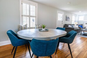 There is seating for 6 around the dining room table.