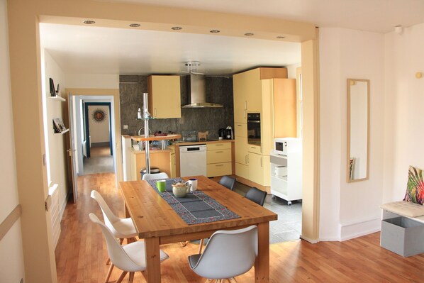 kitchen opening onto dining room