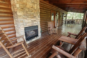 Main level wrap around porch-gas log fireplace to enjoy during cooler weather
