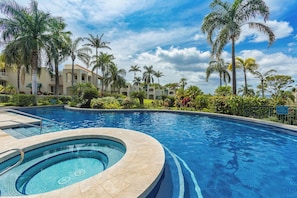Luxurious pool and hot tub on property