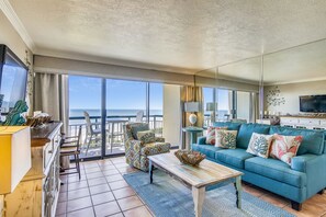 The living room’s view is spectacular - The airy living room opens onto the balcony, which in turn overlooks the soft white sands and the serene beach. You'll love the area with its bountiful wildlife, estuaries, and biking.