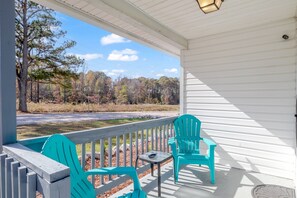 two beachy-blue chairs to sit and enjoy the sunshine and North Carolina weather