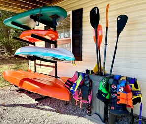 1 sit in kayak, 1 tandem sit on top kayak, 1 children's kayak, & 1 paddle board