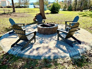 Large firepit with wood provided for guests