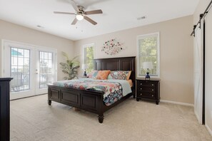 Master bedroom with king bed. The French doors open to the upper deck