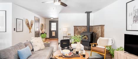 Watch a movie or relax by the fireplace in the living area.