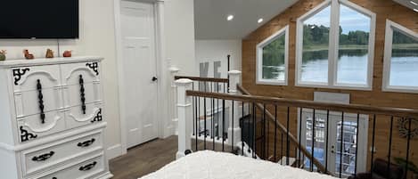 Open loft area with view of the water