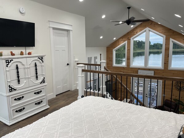 Open loft area with view of the water