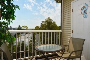 Enjoy morning coffee or afternoon drinks from this private screened balcony located just off the living area of this 2 bedroom, 2 bath condo