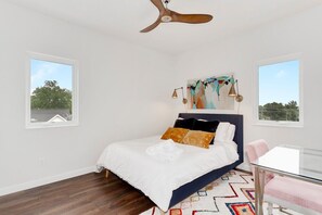 Our Queen bedroom, which is complete with a closet, desk, desk chair and nearby bath.