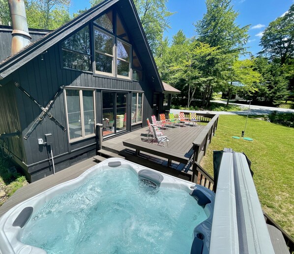 Enjoy the 8 person hot tub an expansive deck with great views 