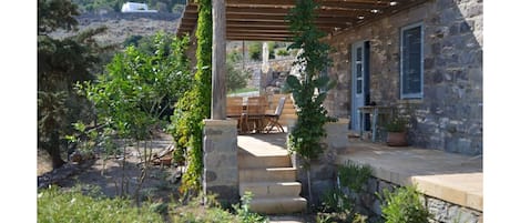 The Farm House with shaded dining terrace.