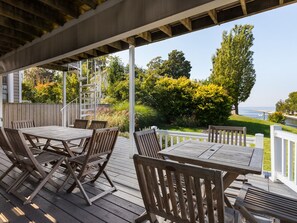 Relax on the Main Level Deck with Dual Outdoor Dining Tables for Food and Fun
