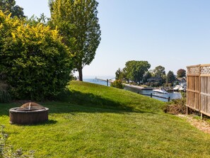 Enjoy the Yard Space with a Firepit and Beautiful Views of the Harbor Beyond