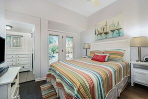 Sink into Comfort in the Master Queen Bedroom, Where French Doors Open to the Quiet Beauty of the Backyard