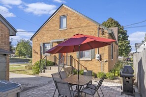 Enjoy Lounging Out Back in the SoHa Sun on Our Home`s Outdoor Patio Area - Complete with a Shade Umbrella
