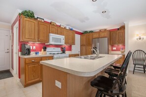 Fully equipped kitchen and counter seating