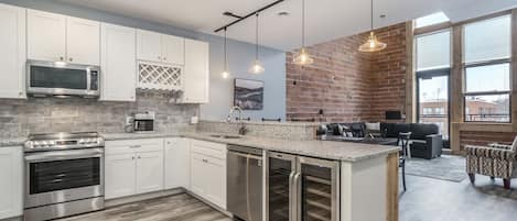 Fully equipped kitchen with open space to dining and living room