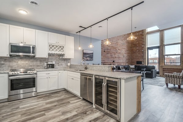 Fully equipped kitchen with open space to dining and living room