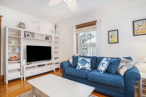 Perfect for Family Movie Nights - A Harbor View`s Living Room Offers Cozy Seating and a Flatscreen TV