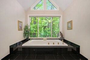 Unwind and Indulge in the Ultimate Comfort of the Master Suite`s Soaker Tub