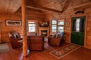 Cozy living area with leather furniture and a fire place