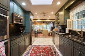 The modern kitchen is well stocked cooking, serving and entertaining
