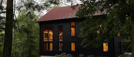 View of the house from the driveway that fits 3-4 cars.  