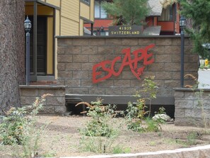 Escape entrance sign on Switzerlalnd Dr.