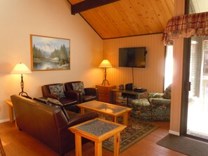 Living room slider opens to upper deck