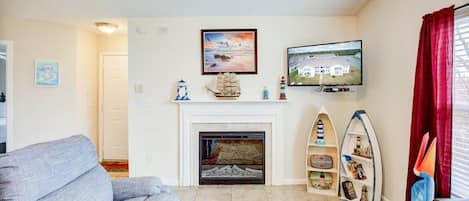 The cozy fireplace and Smart TV provide the perfect atmosphere for an enjoyable evening binge-watching your favorite shows.