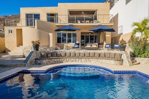 Lounging poolside with exterior view