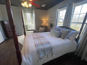 Upstairs “horse” bedroom with small tv, movies, books, toys, rocker chair, crib