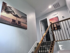 Enjoy the tranquil artwork as you head upstairs to three themed bedrooms