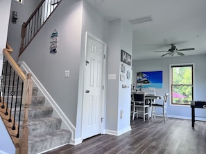 Family room with smart TV and wall mounted electric fireplace, foosball & games