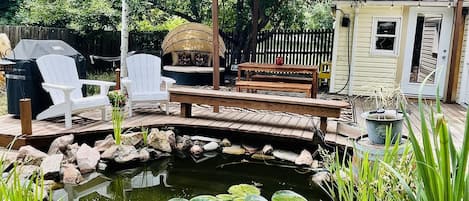 The deck is the spot! Visit our fish, Chicken Nugget (the big koi) and the gang!