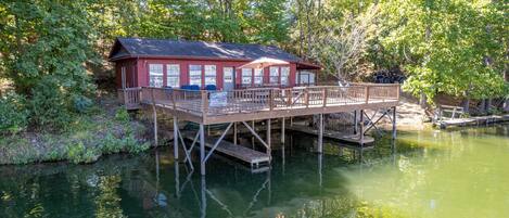 Large dock attached to house.  3 
 boat slips under dock