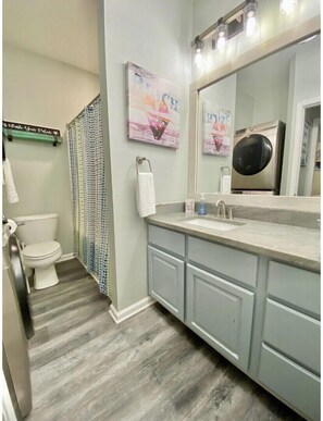 Downstairs bath with laundry room.
