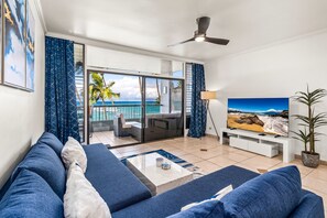 Bright living space opens directly to oceanfront views