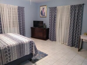 Spacious bedroom with cable tv